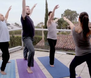 Men's yoga class at Oceanfront Recovery